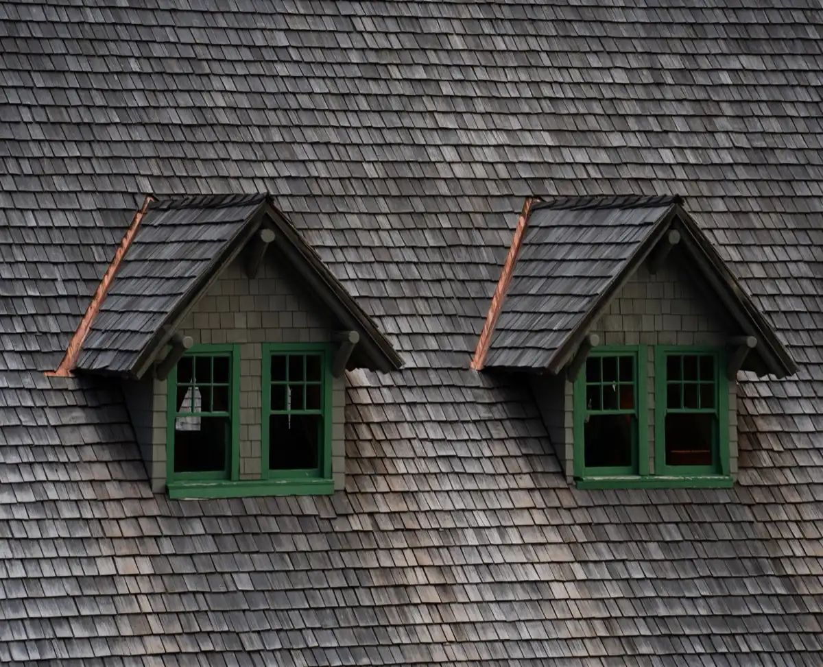 Dormers on a shingle roof in Chula Vista, CA, where step flashing and kickout flashing carry water past the walls